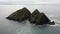 Carter Gull rock at Holywell bay flyback from above islands cornwall uk