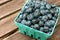 Carton box with fresh ripe blueberries