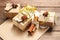 Carton gift boxes with anise, cinnamon and golden ribbon on wooden background