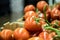 Carton of red ripe  medium-sized tomatoes at market