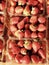 Cartons of late autumn strawberries wait to delight their ravenous consumers