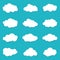 Cartoon cloud of sky on blue background. Graphic heaven in flat style. Set of overcast cloudy. Set icons of cloud bubble shape.