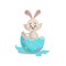 Cartoon cute easter bunny hatching from painted colorful egg. Easter spring vector mascot illustration.