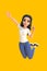 Cartoon funny smiling cute active girl in a white t-shirt, jeans and sneakers jumping in the air on a bright yellow background