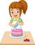 Cartoon girl decorating a birthday cake