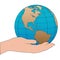 Cartoon hand holds a western hemisphere globe