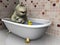 Cartoon hippo in bathtub.