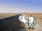 Cartoon Hitchhiker, alone on a desert road photo