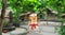 Cartoon man in Japanese kimono standing in the yard with trees