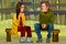 Cartoon man and woman find out the relationship sitting on a bench