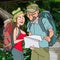 Cartoon man and woman tourists in the jungle