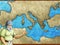 Cartoon map scene with greek or roman character or trader merchant with mediterranean sea illustration for children