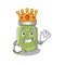 A cartoon mascot design of pistachio butter performed as a King on the stage