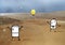 Cartoon Men Lost in a wild Sand Desert Happy to see a Yellow light Bulb