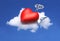 Cartoon red heart resting on a pillow above a cloud