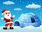 Cartoon santa claus with igloo in winter