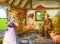 Cartoon scene with farmer rancher in the barn pigsty with his guest