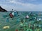 Cartoon Scuba man Diving near a Big pile of Garbage, on Ocean photo