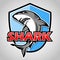 Cartoon shark with blue shield