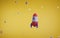 Cartoon space rocket in galaxy on yellow background planets or stars, flying across universe. Spaceship launching