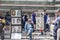 Cartoonist sitting waiting for customers in the Piazza del Duomo, behind, tourists and part of the wall of the Cathedral