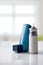 Cartridge and blue medicine inhaler in room front view vertical