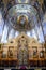 Carved altar ornament and dome decorated with frescoes in the Church of the Savior on Spilled Blood in St. Petersburg, Russia