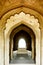 Carved archways with cenotaph visible in humayun`s tomb