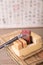 A carved bed with a stone seal and a carving knife on the old book