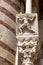 Carved figure at the south entrance to the Duomo, Cattedrale Santa Maria Matricolare, Verona, Italy