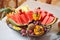 Carved fruits arrangement. Fresh various fruits. Assortment of exotic fruits.