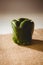 Carved green bell pepper on sack