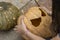 Carved Halloween pumpkin, jack lantern, with carving tools. Spooky laughing, scary head.