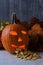 Carved Halloween Pumpkin with seeds spilling out of mouth.