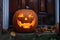 carved and illuminated jack-o-lantern on a doorstep