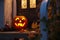 carved and illuminated jack-o-lantern on a doorstep