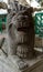 Carved lion at the entrance of Taoist temple on the Lamma island