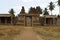 Carved pillars of the inner courtyard, cloisters or pillared verandah and the east gopura. Achyuta Raya temple, Hampi, Karnataka.
