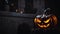 a carved pumpkin sitting on top of a stump with the word