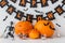 Carved pumpkins with candies and halloween garland