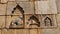 Carved sculpture of Shivalinga and Nandi on the wall of Chitradurga fort, Karnataka