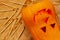 Carved smiling Scary Halloween pumpkin and matches