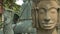 Carved stone Buddha statues in San Tok, Cambodia