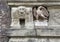 Carved stone eagle sculpture on the front facade of the d\\\'Accursio Palace in Bologna, Italy.