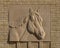 Carved stone horse head relief on the outside brick wall of the Will Rogers Equestrian Center in Fort Worth, Texas.