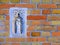 Carved stone Madonna and Child set in brick wall