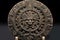 carved stone relief of an aztec calendar