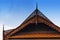 Carved wooden eaves Clay roof of ancient Thai style.