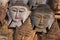 Carved wooden heads of Buddha