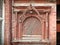 Carved wooden window on Hanuman Dhoka old Royal Palace in Kathmandu, Nepal.